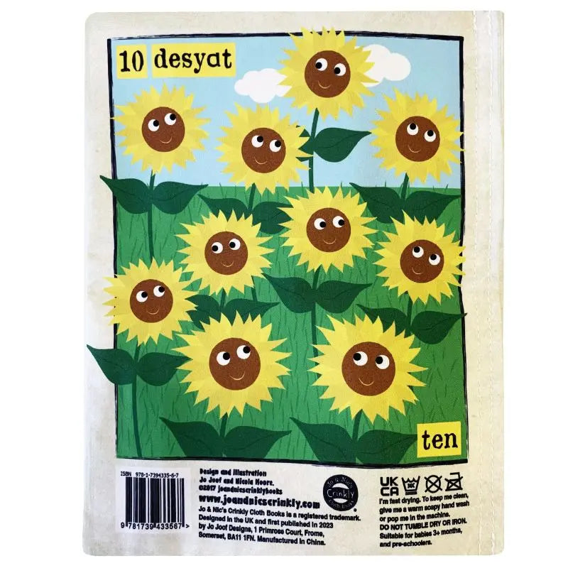 An illustrated page from the Crinkly Cloth Book Count To 10 In Ukrainian features ten smiling sunflowers in a field under a blue sky, with "ten" and its Ukrainian translation "desyat" at the top and bottom.