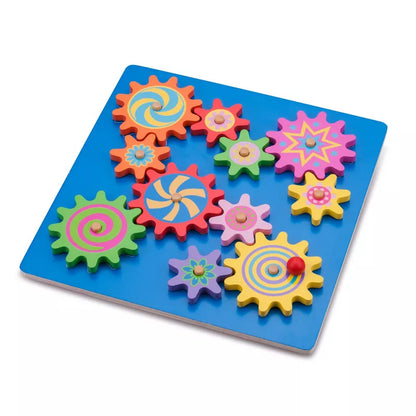 A blue tray with the New Classic Toys Spinning Gear Puzzle on it.