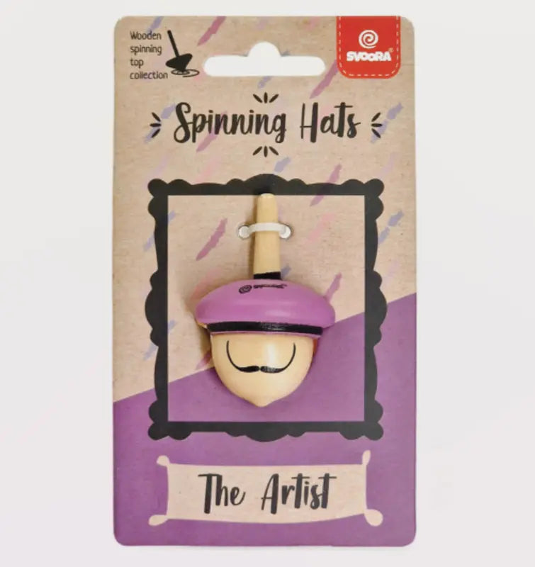 The Wooden Spinning Top The Artist features a face with a mustache and purple beret, displayed on a purple and tan card. Perfect for children to enhance fine motor skills. "Svora" brand is shown in the top right corner.