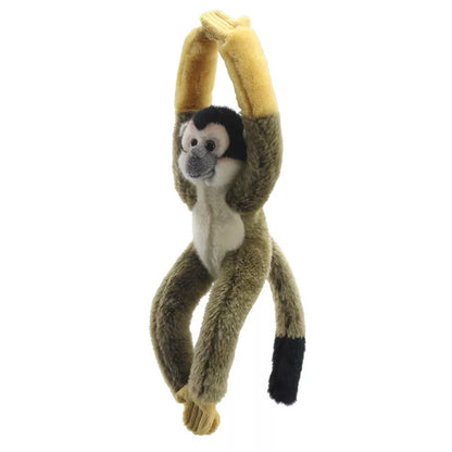 Squirrel Monkey Canopy Climber toy hanging by the tail with arms outstretched against a white background, inspiring creative play.