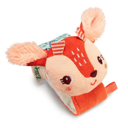 The Lilliputiens I'm Discovering Stella Bracelet Rattle is a soft, plush deer-shaped toy with peachy ears, a cute face, embroidered details, and a colorful strap. It makes an ideal baby toy or rattle bracelet and is perfect as a charming birth present.