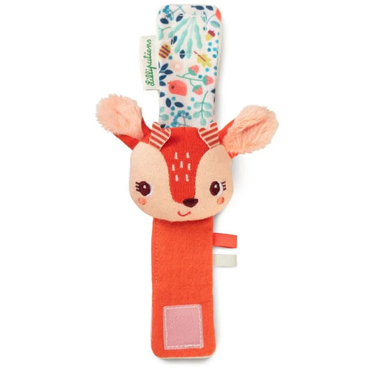 The Lilliputiens I'm Discovering Stella Bracelet Rattle is a soft, plush baby rattle shaped like a deer's head on a fabric strap. It features a colorful floral pattern on one side, solid orange on the other, Velcro for securing, and small orange ears—a perfect birth present with its friendly embroidered face.