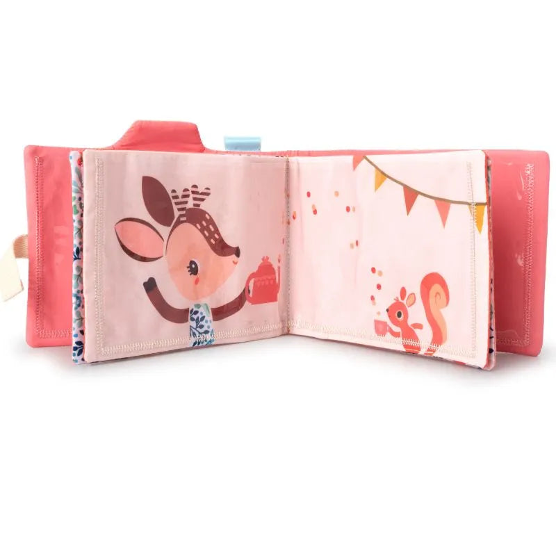 The Lilliputiens I'm Discovering Stella Photo Album, a vibrant children's cloth book, features playful scenes like a mouse-like creature with cake and a squirrel with party bunting. Its light red cover and spine make it perfect for enhancing long car journeys.