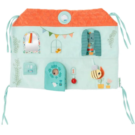 The Lilliputiens I'm Discovering Stella & Joe House Soft Discovery Panel is a whimsical fabric toy designed as a house with interactive features like windows, doors, colorful decorations, buttons, flaps, and embroidered details—making it an ideal first toy and baby gift.