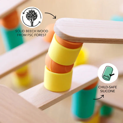 A Stix Building Game that promotes fine motor skills and creativity, featuring a wooden structure adorned with vibrant yellow, orange, and green hues.