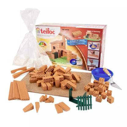 A group of Teifoc Brick Construction - Small Cottage bricks and a box for Teifoc Brick Construction - Small Cottage construction.