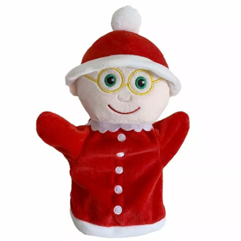 The Puppet Company My First Christmas Puppet Mrs Claus is a delightful hand puppet, perfect for Christmas storytelling. She's dressed in a festive red outfit with white trim, featuring round yellow glasses and a red hat adorned with a pom-pom. With her smiling face and green eyes, she's the perfect stocking stuffer to spread holiday cheer.