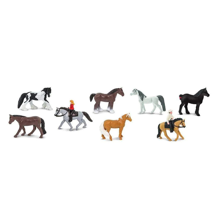 A group of Safari Ltd TOOBS® Figurines Horses & Riders standing next to each other.