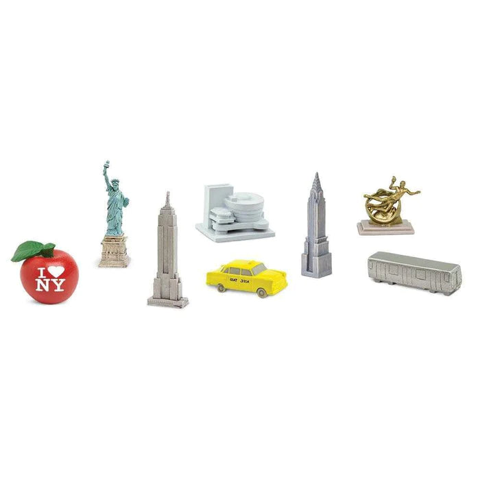 a group of TOOBS® Figurines New York City, including a Statue of Liberty, a bus, and more.