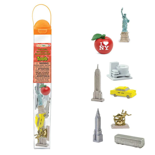A package of TOOBS® Figurines New York City with a Statue of Liberty, a bus, an apple.