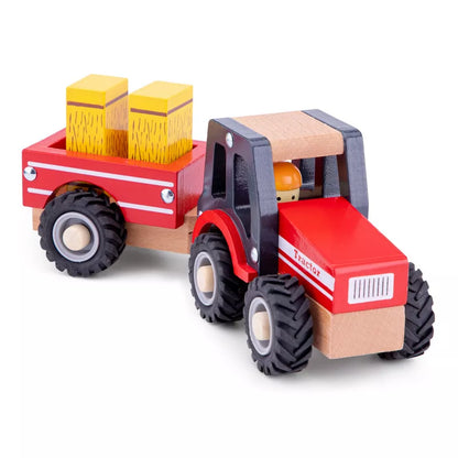 A New Classic Toys wooden tractor with trailer and hay stacks.
