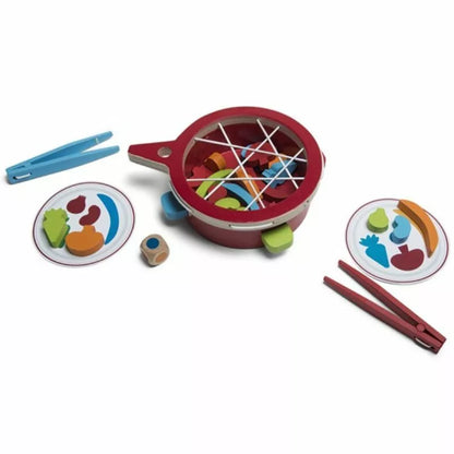 a Buitenspeel Veggie Game set with a bowl, spoon and chopsticks.