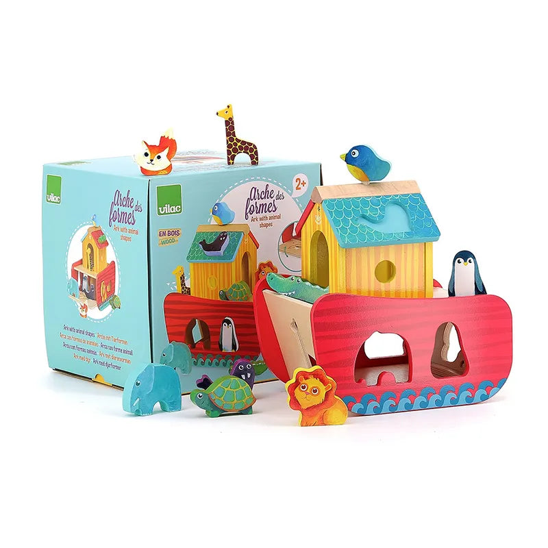 The Vilac Animals Ark Shape Sorter is a vibrant wooden toy set, perfect for children aged 2 years and up. It features a colorful Noah's Ark with animal shape cut-outs and includes figures like a giraffe, lion, turtle, fox, elephant, and penguins. The packaging displays an illustration of the toy and the brand's logo.