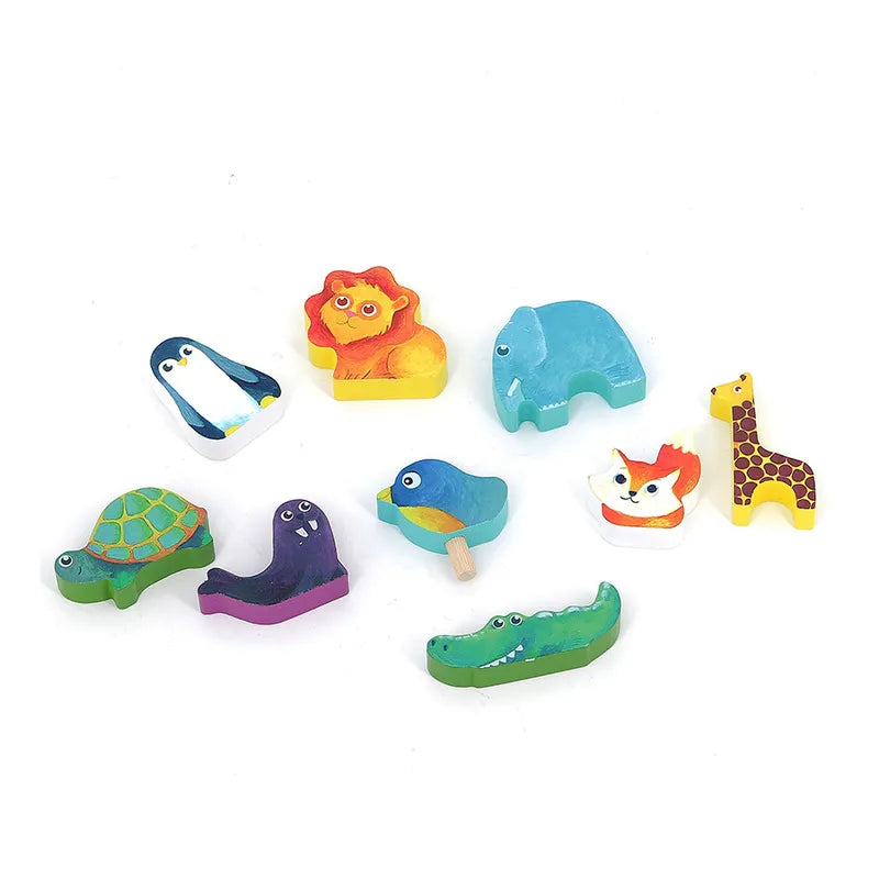 On a white background, vibrant, small figurines from the Vilac Animals Ark Shape Sorter are displayed. Ideal for children aged 2 years and up, the collection features a penguin, lion, elephant, giraffe, turtle, bird, fox, alligator, and a purple sea creature. Each wooden toy animal is brightly painted and uniquely stylized.