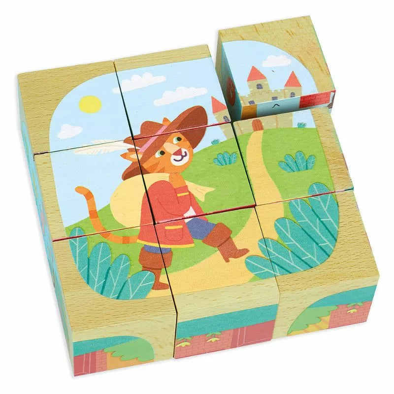 The Vilac Wooden Blocks Tales set includes nine cubes that assemble to create a vibrant picture of a cat donning a hat and boots, strolling along a path flanked by greenery. A castle graces the background, making it an enchanting fairy tale puzzle that is perfect for toddlers.