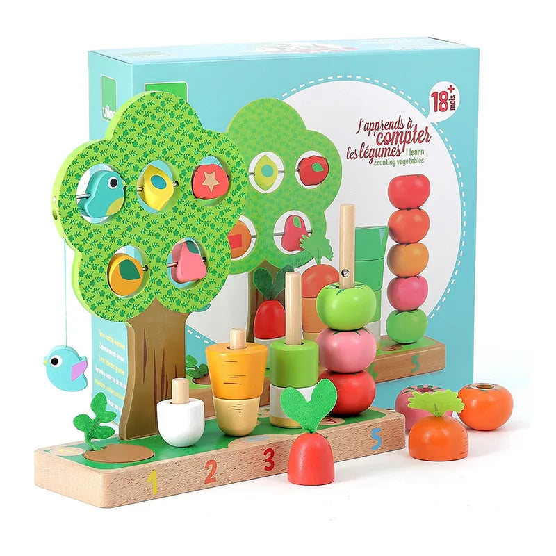 Introducing the Vilac I Learn Counting Vegetables, a vibrant wooden toy set perfect for toddlers aged 18 months and up. This educational kit features a vegetable counting activity with a delightful tree that has removable parts, assorted shaped vegetables, and a base displaying numbers 1 to 5. The packaging showcases the assembled toy along with detailed instructions.