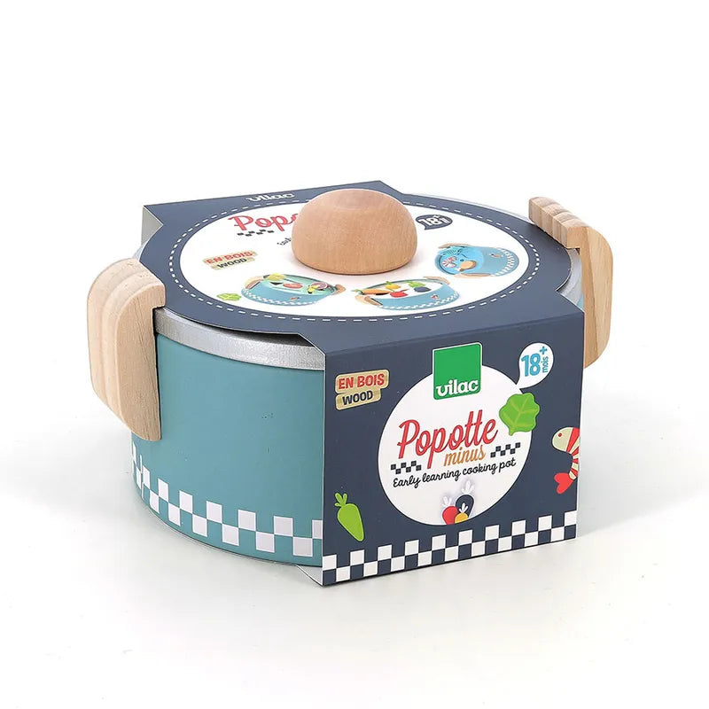 An image of the Vilac Early Learning Cooking Pot, a round wooden toy pot with a lid, designed for early learning cooking play. This blue pot features checkered patterns on the edge and wooden handles. The packaging indicates it is suitable for children aged 18 months and older.