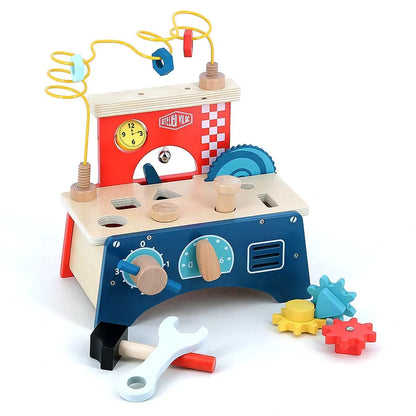 The Vilac Early Learning Workbench is a colorful wooden toy designed for children aged 18 months and older. It includes a variety of tools and features such as a clock, gears, a saw, a wrench, and multiple bead maze wires on top. The structure is painted in blue, red, and yellow to engage children in imaginative play and development.