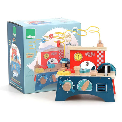 The Vilac Early Learning Workbench is a vibrant wooden activity center designed for children 18 months and older. It features engaging elements such as gears, a clock, and a bead maze. Branded "Vilac," the toy comes with packaging adorned with cheerful illustrations and brand logos.