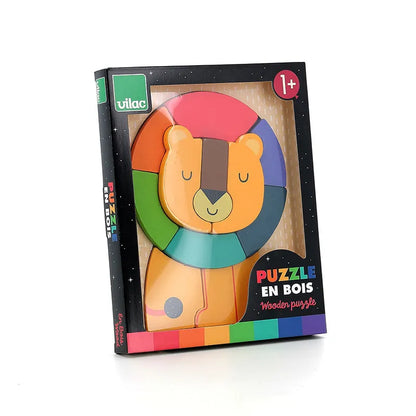 The Vilac Lion Wooden Puzzle is a boxed wooden toy designed for children aged 1 year and up. This engaging puzzle forms a colorful lion with a mane segmented into different colors. The packaging prominently features the "Vilac" branding and states "Puzzle en Bois - Wooden puzzle," with the box adorned in a black frame highlighted by rainbow accents.