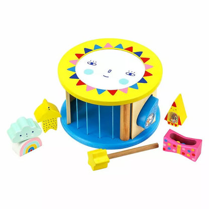 a Vilac Night and Day Shape Sorter with a sun and other toys.