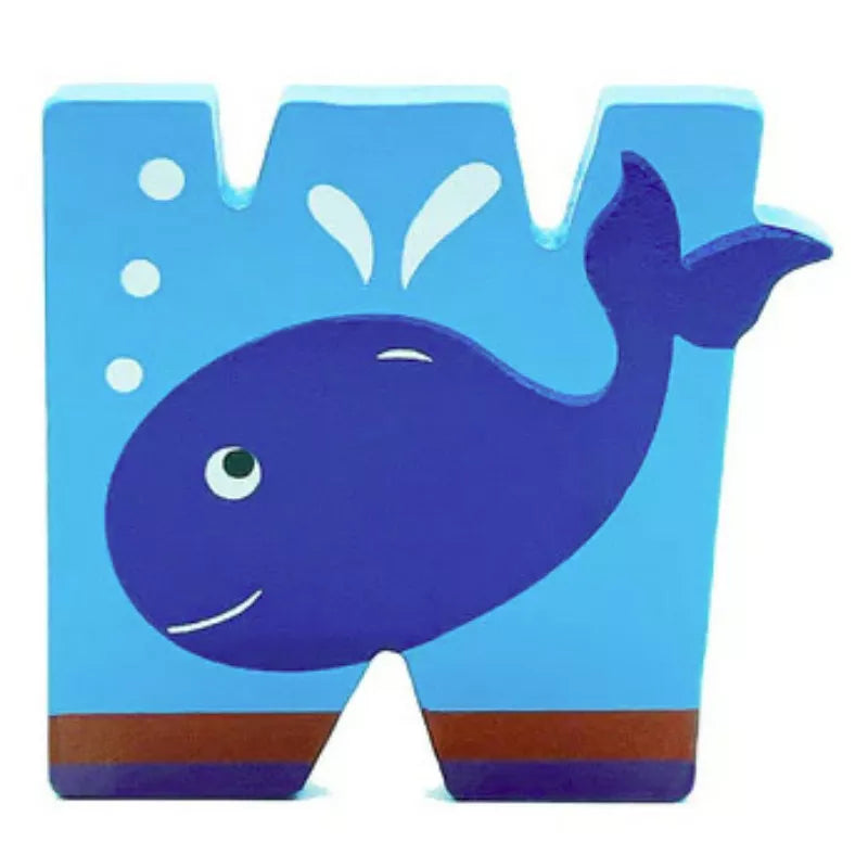 a wooden letter animal - W of a blue whale in the water.