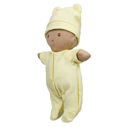 The Wilberry Baby Doll in Yellow Outfit, featuring brown fabric skin, a matching hat with bear ears, basket, and blanket, is displayed against a white background—an ideal gift for newborns.