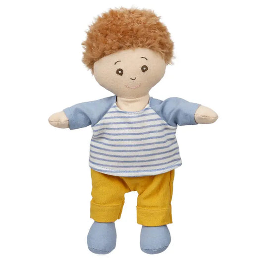 The Wilbery Baby Doll Boy Blue Outfit is a soft fabric doll with light brown curly hair, wearing a blue and white striped shirt, yellow pants, and blue shoes—perfect for cuddling and playtime.