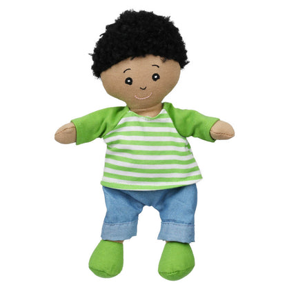 The Wilbery Baby Doll Boy Green Outfit features a baby boy with short black curly hair, wearing a green and white striped shirt, blue pants, green shoes, and has a friendly smile with outstretched arms.