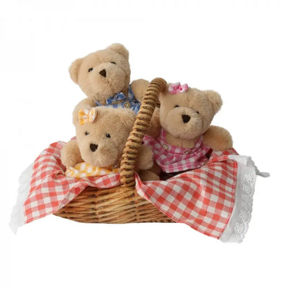The Wilberry Teddy Bears’ Picnic Soft Toy Set includes three plush teddy bears in colorful outfits sitting in a picnic basket lined with red and white checkered cloth, perfect for imaginative play and a delightful teddy bears' picnic.