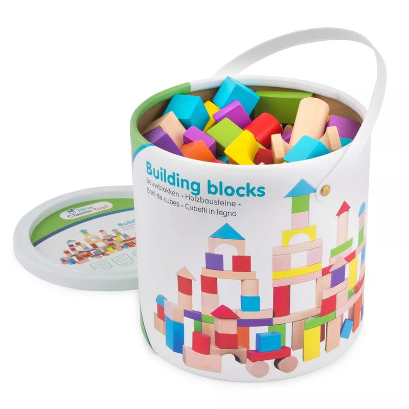 A bucket of New Classic Toys 100 Building Blocks sitting on top of a white table.