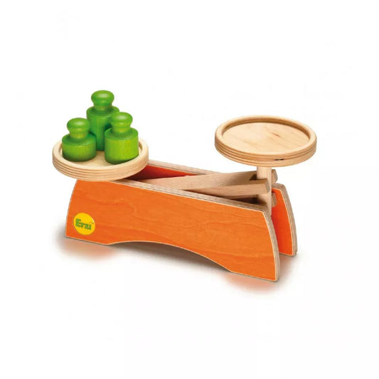 A wooden toy Wooden Scale with green and orange containers.
