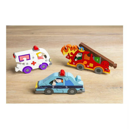 A group of Alphabet Jigsaws Emergency Number Puzzle toys by Alphabet Jigsaws sitting on top of a wooden table.