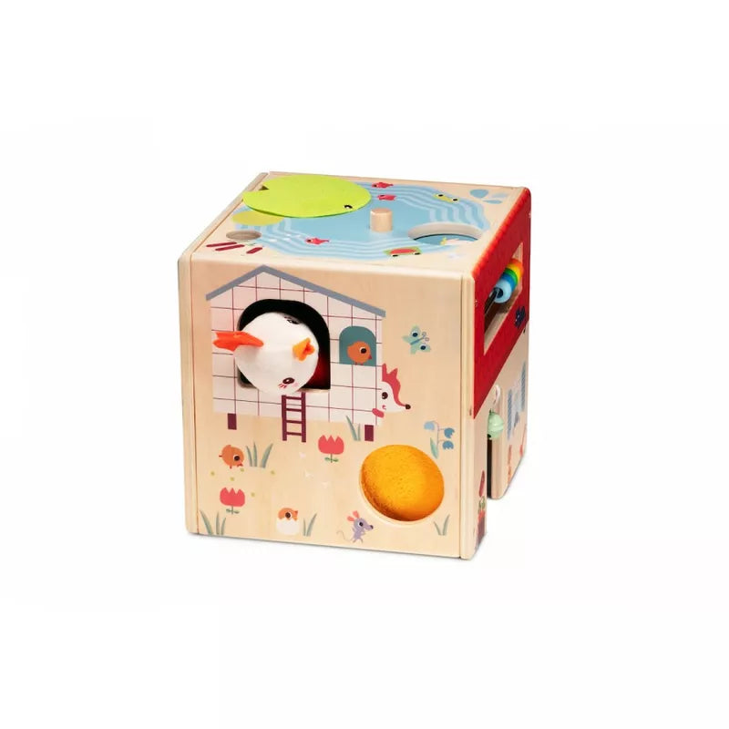 A Lilliputiens Wooden Activity Cube Farm with a penguin and a house on it.