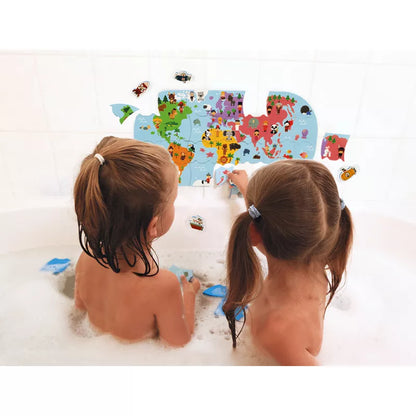 Two little girls playing with the Janod Bath Explorers Map in a bath tub.