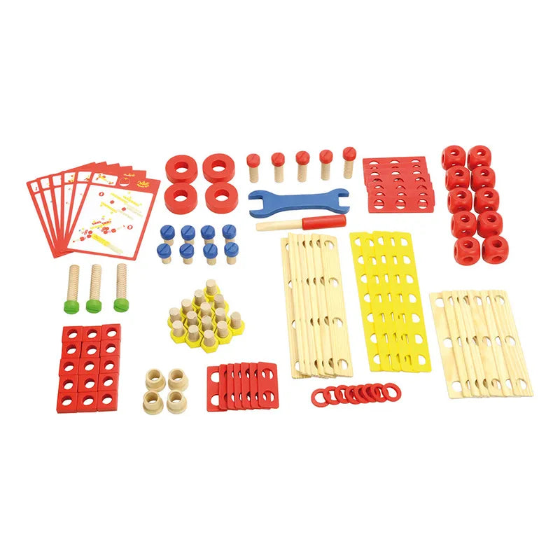 An assortment of colorful Vilac My Construction Set pieces is spread out on a white surface. This wooden toy set, perfect for children aged 4 years and up, includes red, yellow, and blue components, wooden rods, wrench-like tools, instruction cards, nuts, bolts, and various fastening elements.