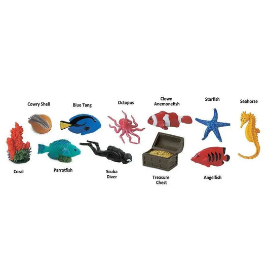 A collection of various marine figurines and objects including a cowry shell, blue tang, octopus, clown anemonefish, starfish, seahorse, TOOB® Figurines Coral Reef.