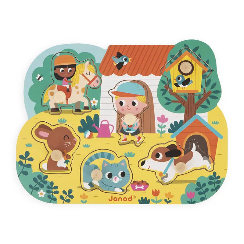 The Janod Country Puzzle Peg Puzzle is a vibrant wooden toy for toddlers, featuring a colorful farm scene with figures like a child on a horse, another with a red cat, and a brown dog by its doghouse. It enriches fine-motor skills amidst various animals and plants in the background.