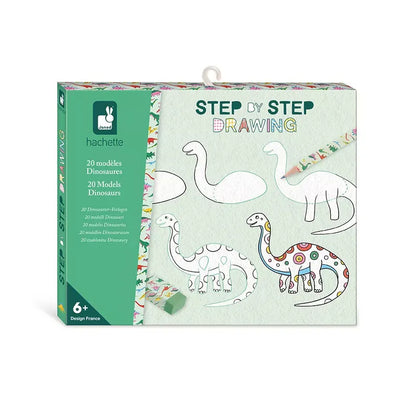 A box labeled "Janod Step By Step Drawing 20 Models Dinos" displays several illustrations of dinosaur outlines, a progression from simple shapes to detailed drawings. The green packaging, ideal for ages 6 and up, features text in multiple languages and boasts 20 dinosaur models in this engaging drawing kit.