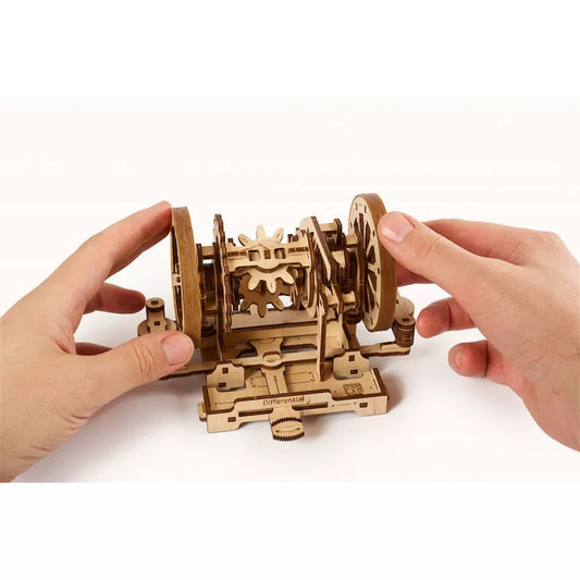 a person is holding a Ugears Differential STEM Lab Model.