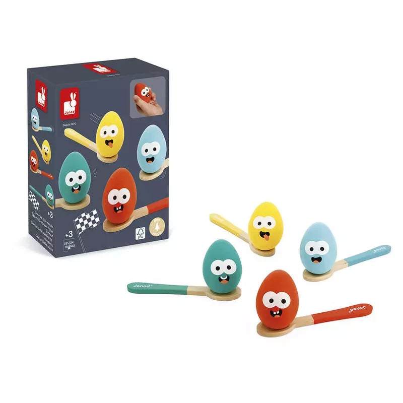 Colorful animated character Janod Egg-And-Spoon Race with expressive faces, designed as toys for children, alongside their packaging box displaying various designs.