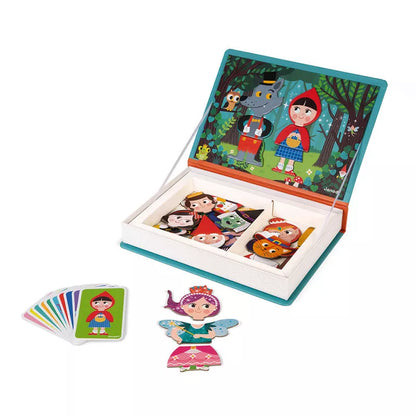 An open Janod Fairy Tales Magneti’Book with magnets and stickers in it.