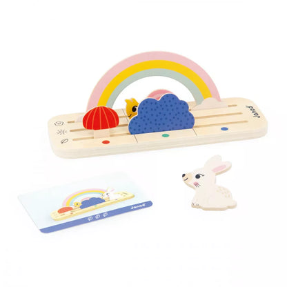 A wooden toy with a rainbow and clouds.