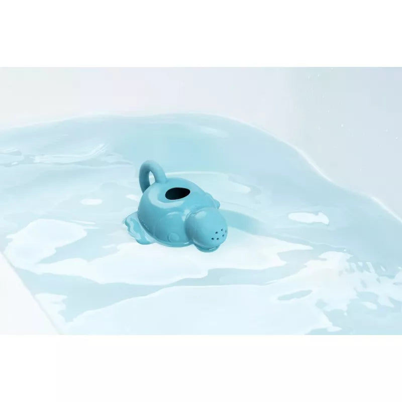 a blue Pablo Floating Watering Can ECO floating in a pool of water.