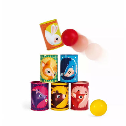 A colorful collection of Janod Forest Tumbling Cans with cheerful animal faces being knocked over by a ball in motion, perfect for active play at an outdoor party.