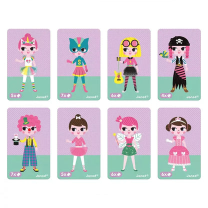 An image shows eight cards, each featuring a unique girl character with different colorful costumes, accessories, and hairstyles on purple backgrounds. Below each character, age recommendations and the brand name "Janod Girl's Costumes Magneti'book" are displayed, highlighting this educational toy as a vibrant magnetic game.