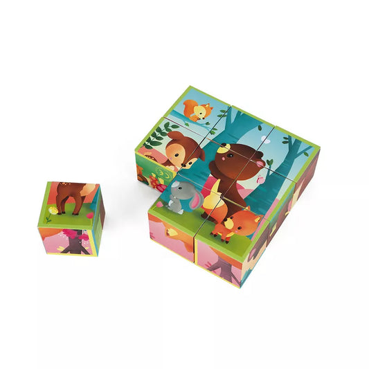 A set of Janod Kubkid 9 Blocks Forest Animals sitting on top of a white surface.