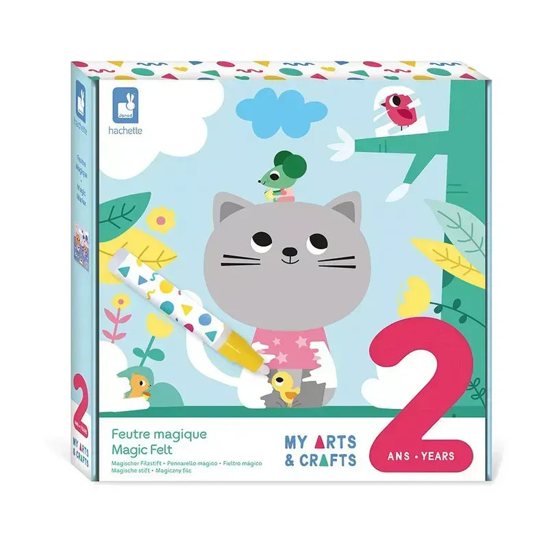 A box for the Janod 2 Years - Magic Felt children's creative kit, featuring a cartoon cat holding a water marker, with a bird on its head and another in the foreground. The packaging showcases colorful graphics of trees and leaves and indicates it's suitable for ages 2 and up.