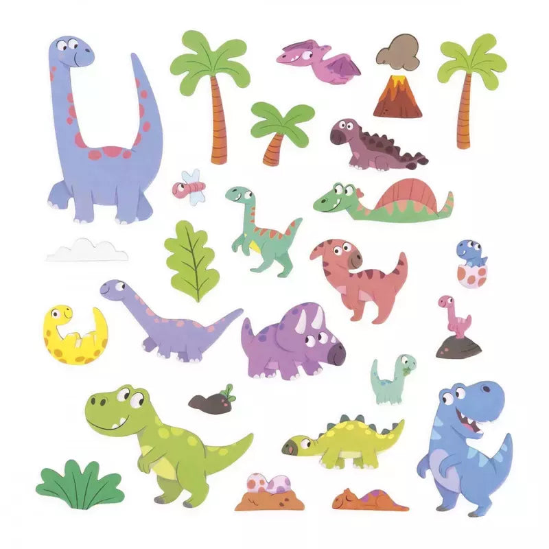 A collection of Janod Magneti'stories Dinosaurs with assorted designs, including trees, a volcano, and foliage.