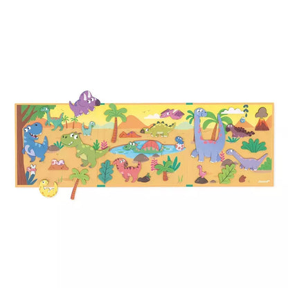 A colorful Janod Magneti'stories Dinosaurs children's magnetic game showcasing various friendly cartoon dinosaurs in a prehistoric landscape with palm trees, volcanoes, and lush vegetation.